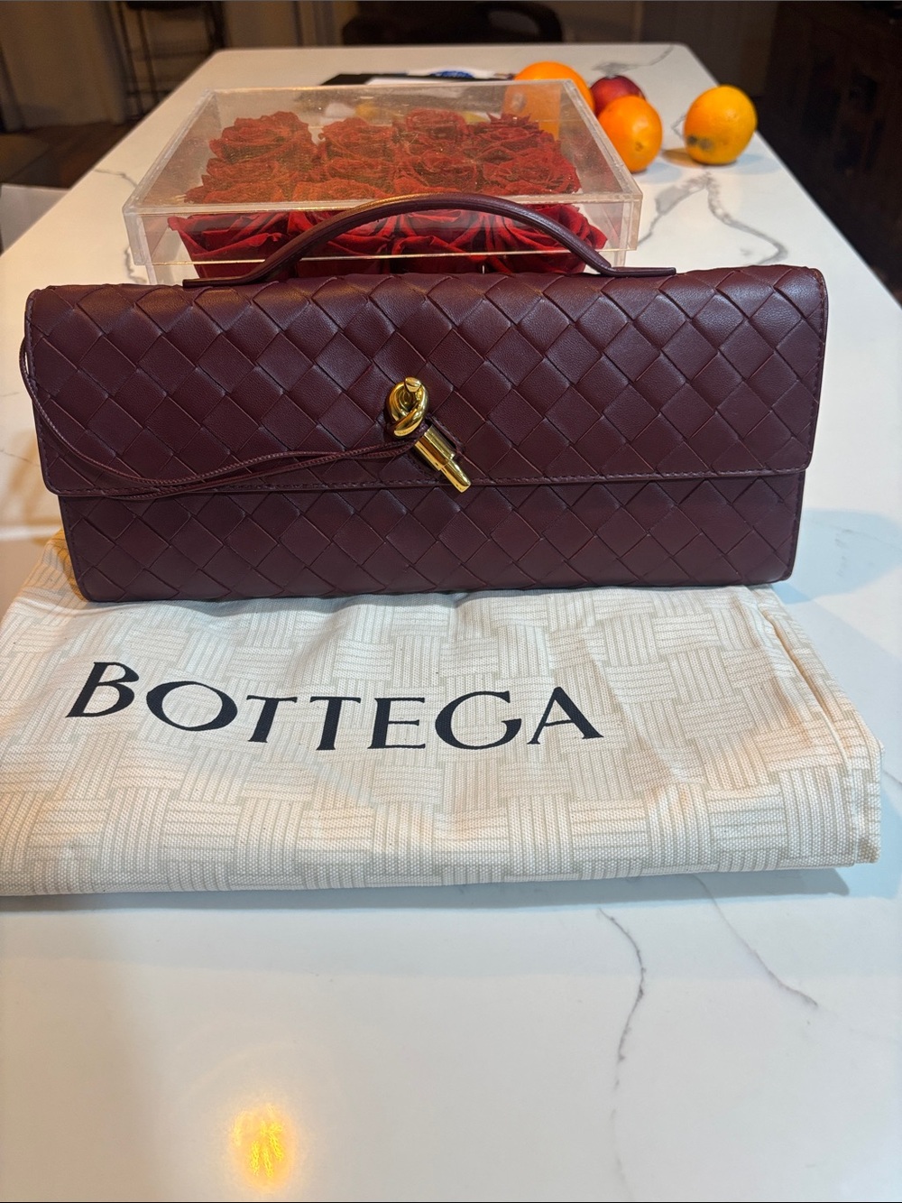 Bottega Veneta Bordeaux Intrecciato Leather Clutch with Gold Accent